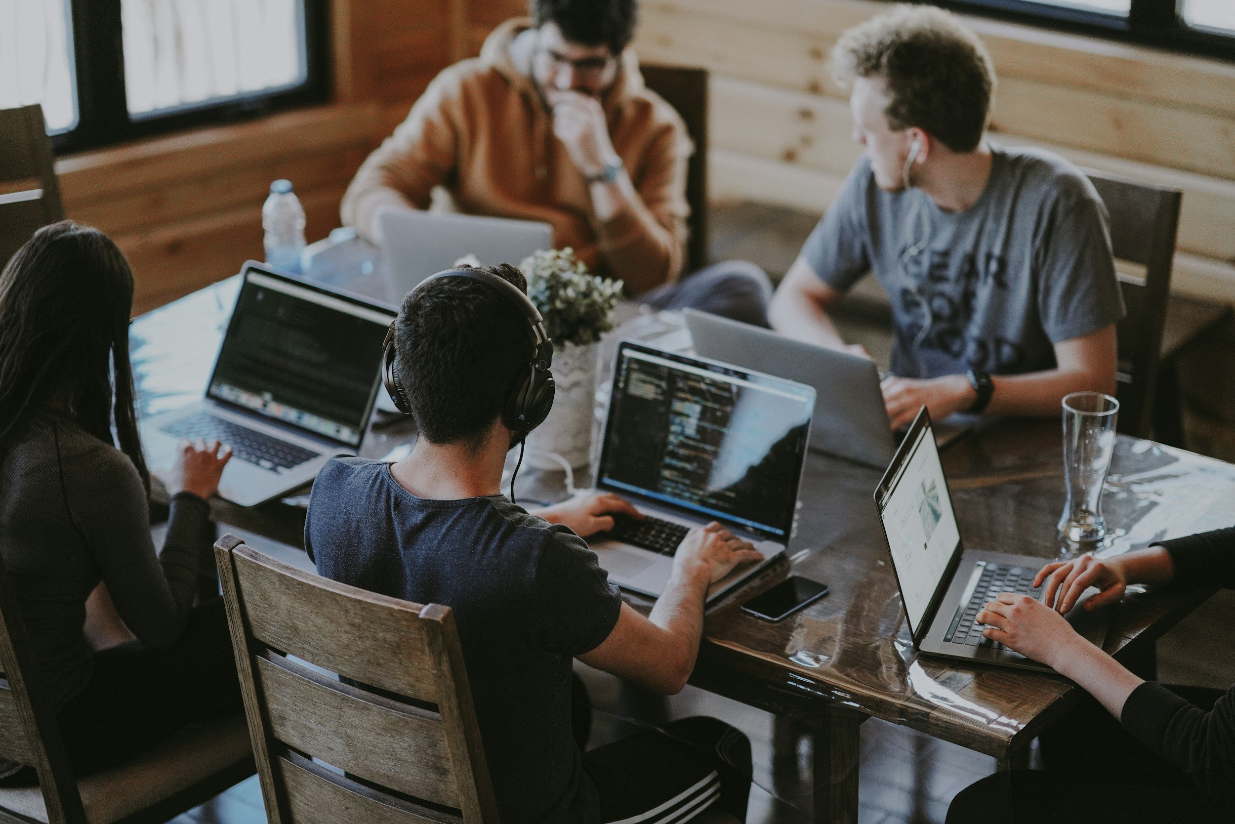 Team working together around a wooden table